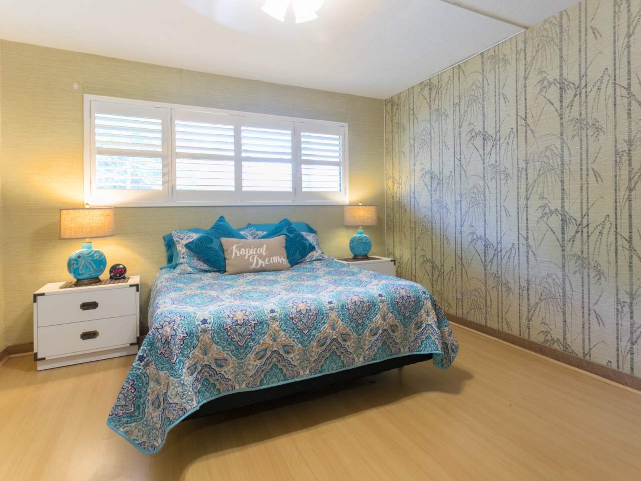 2075 South Kihei Road, Unit 113 Kihei, HI 96753 - Photo 12 of 24 a bedroom with a bed and a window