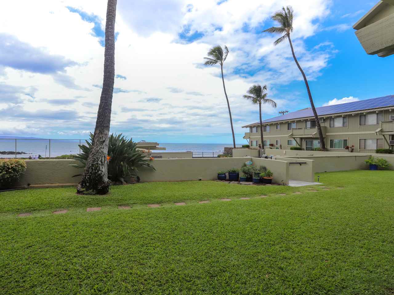 2075 South Kihei Road, Unit 113 Kihei, HI 96753 - Photo 19 of 24 a view of a patio with a yard