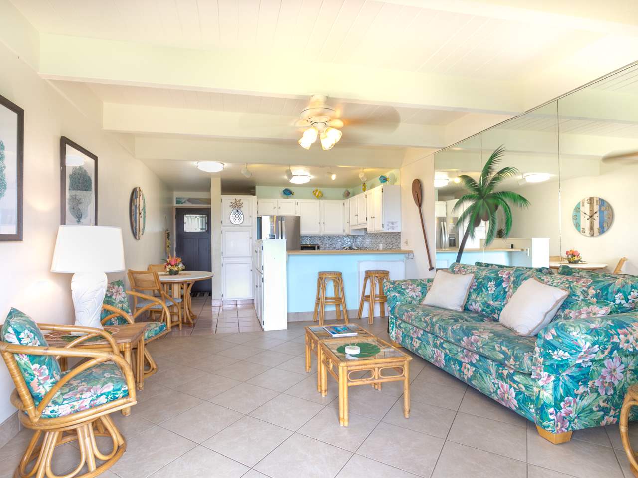 2075 South Kihei Road, Unit 113 Kihei, HI 96753 - Photo 2 of 24 a living room with furniture and a chandelier