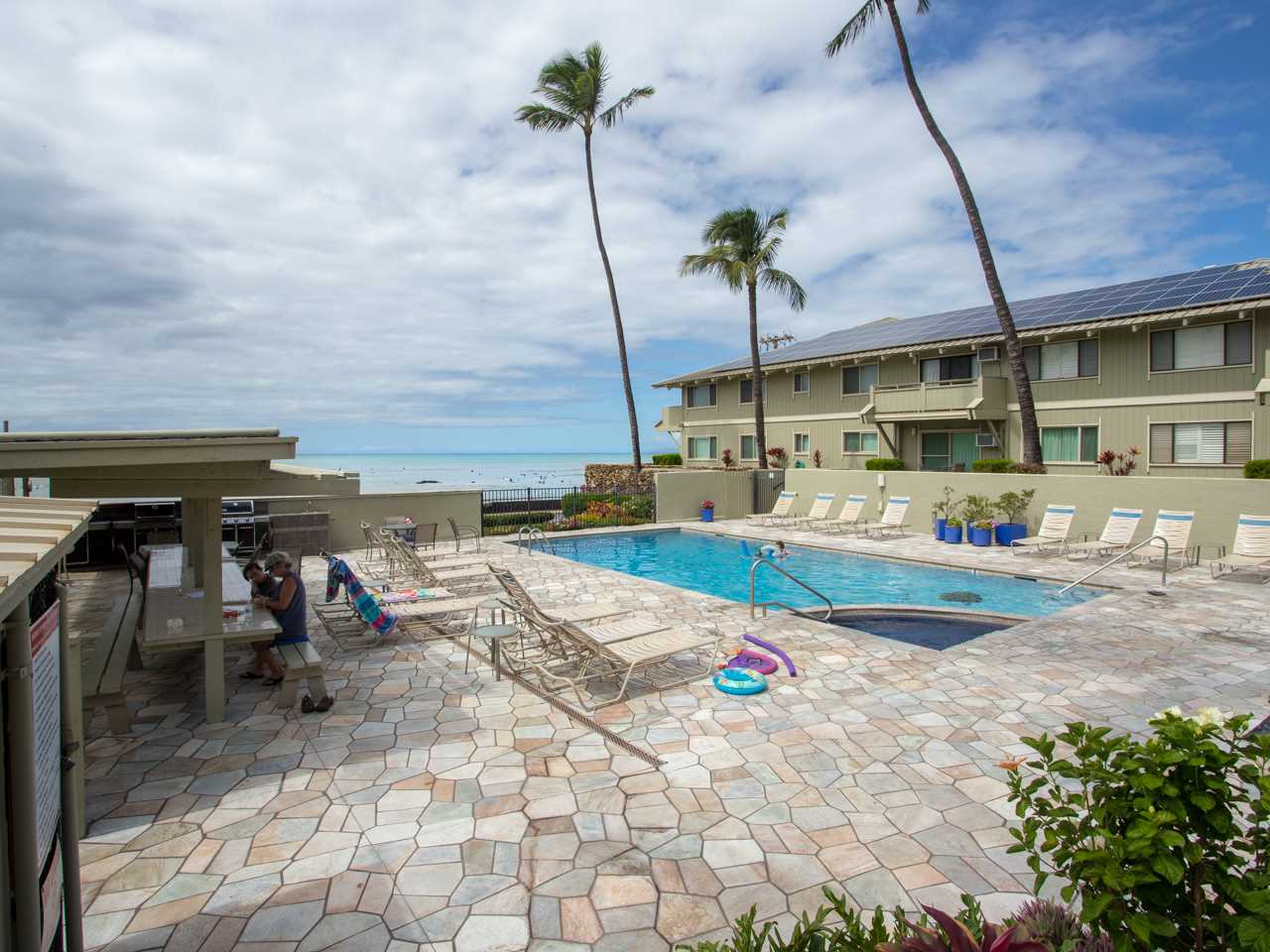 2075 South Kihei Road, Unit 113 Kihei, HI 96753 - Photo 24 of 24 a view of a swimming pool with a lawn chairs