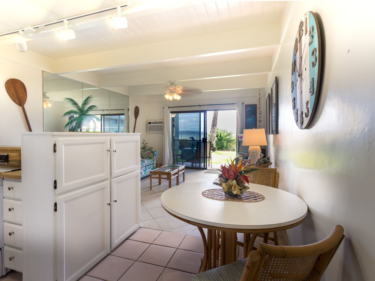 2075 South Kihei Road, Unit 113 Kihei, HI 96753 - Photo 5 of 24 a view of a dining room with furniture and a chandelier