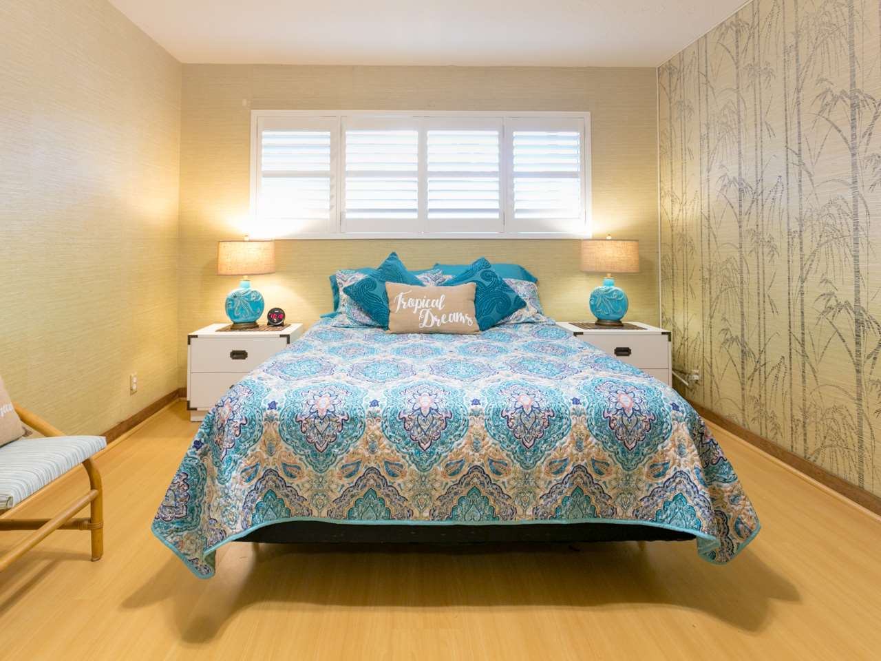 2075 South Kihei Road, Unit 113 Kihei, HI 96753 - Photo 10 of 24 a bed sitting in a bedroom next to a window