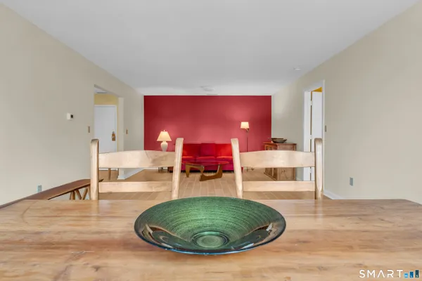 a view of a livingroom with furniture and a table