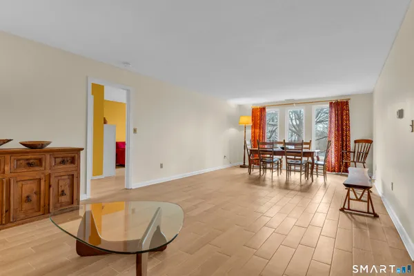 a view of room with furniture and wooden floor