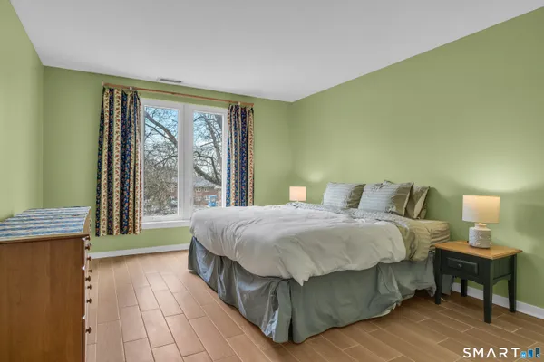 a bedroom with a bed and a dresser