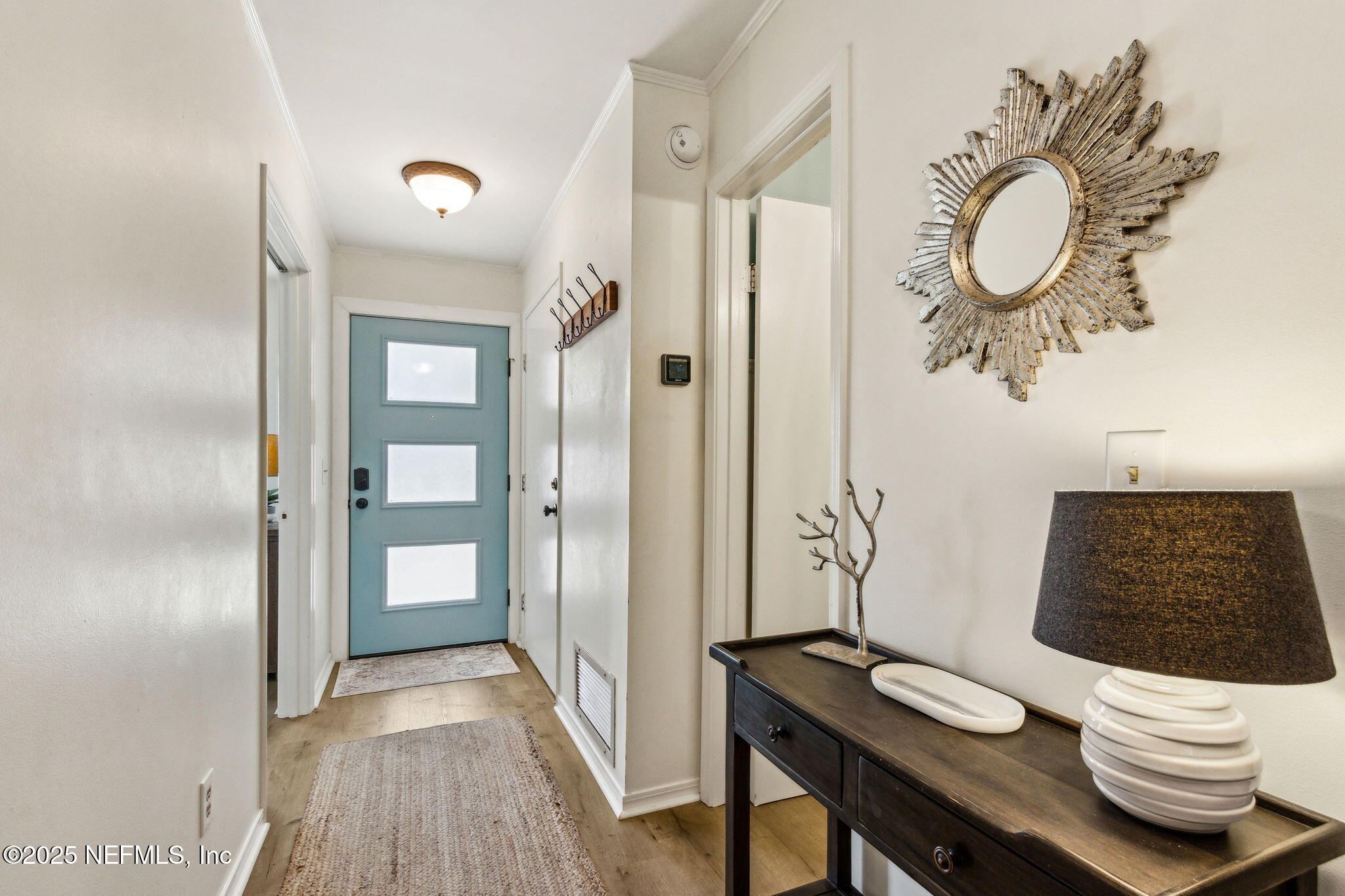 2751 West 5th Street, Unit B Fernandina Beach, FL 32034 - Photo 12 of 61 a view of a bathroom sink and a mirror