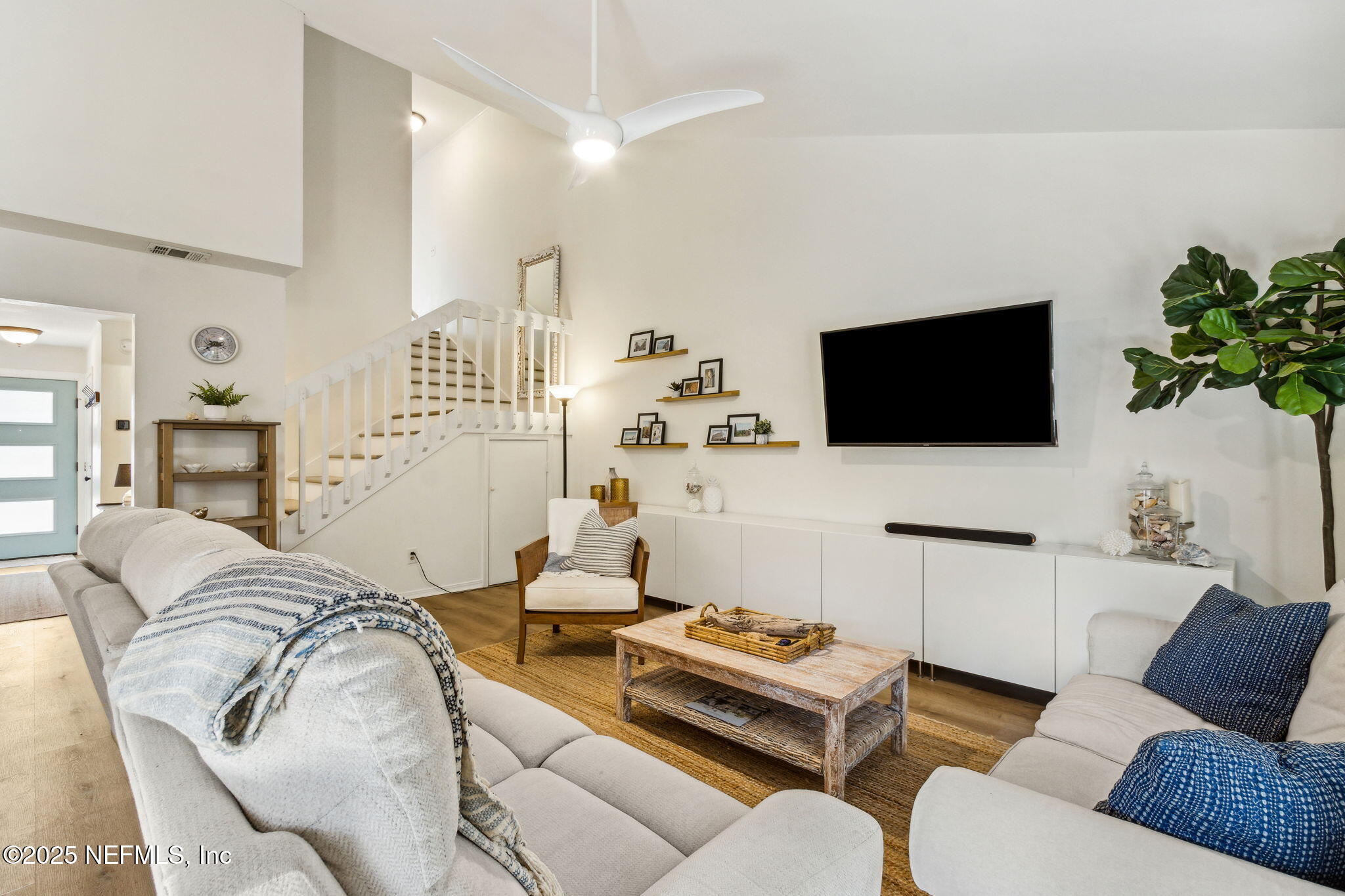 2751 West 5th Street, Unit B Fernandina Beach, FL 32034 - Photo 15 of 61 a living room with furniture and a flat screen tv