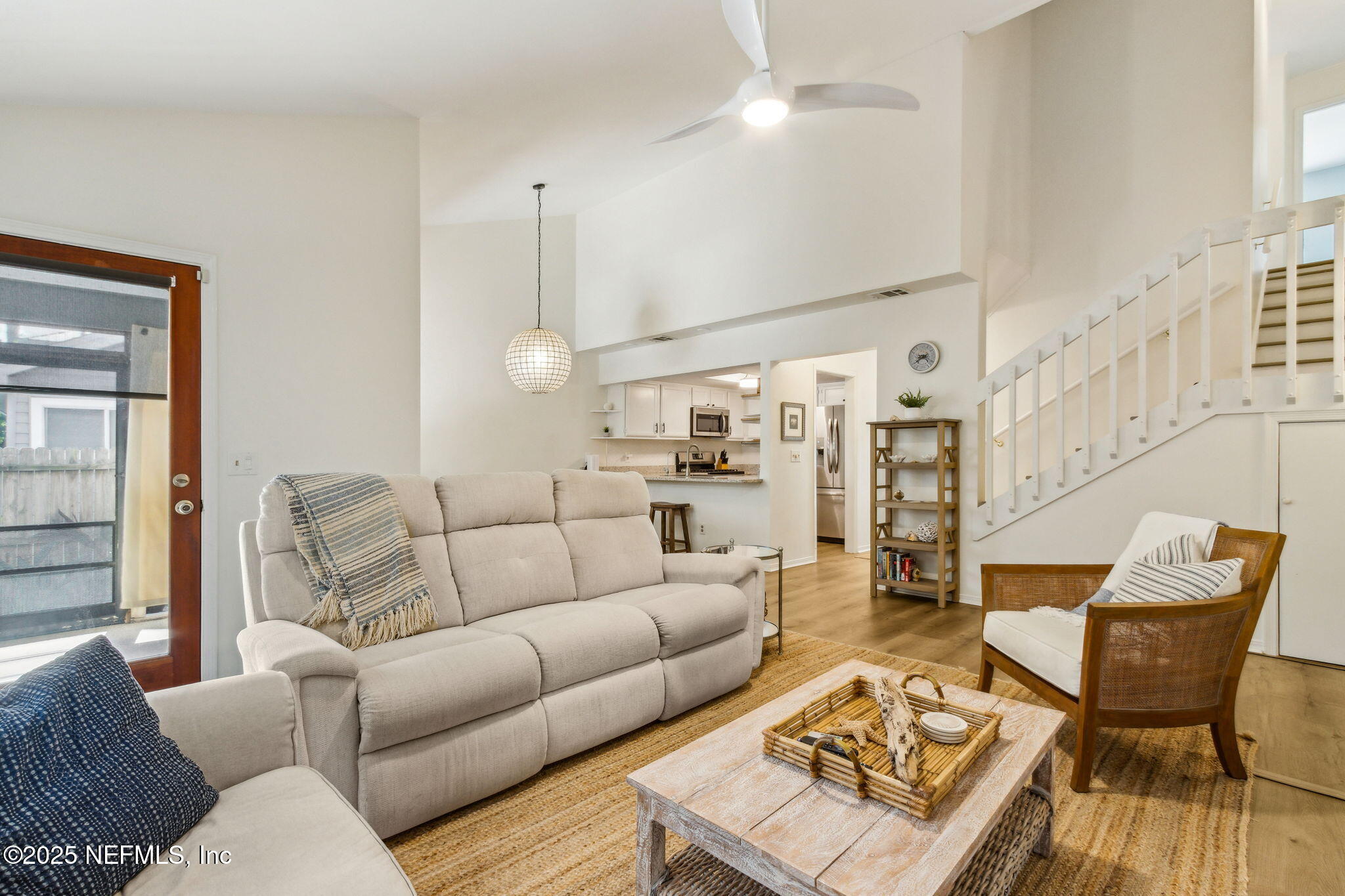 2751 West 5th Street, Unit B Fernandina Beach, FL 32034 - Photo 16 of 61 a living room with furniture and wooden floor