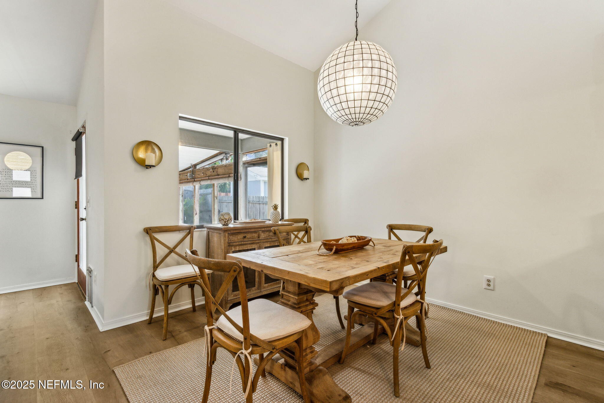2751 West 5th Street, Unit B Fernandina Beach, FL 32034 - Photo 21 of 61 a view of a dining room with furniture and wooden floor
