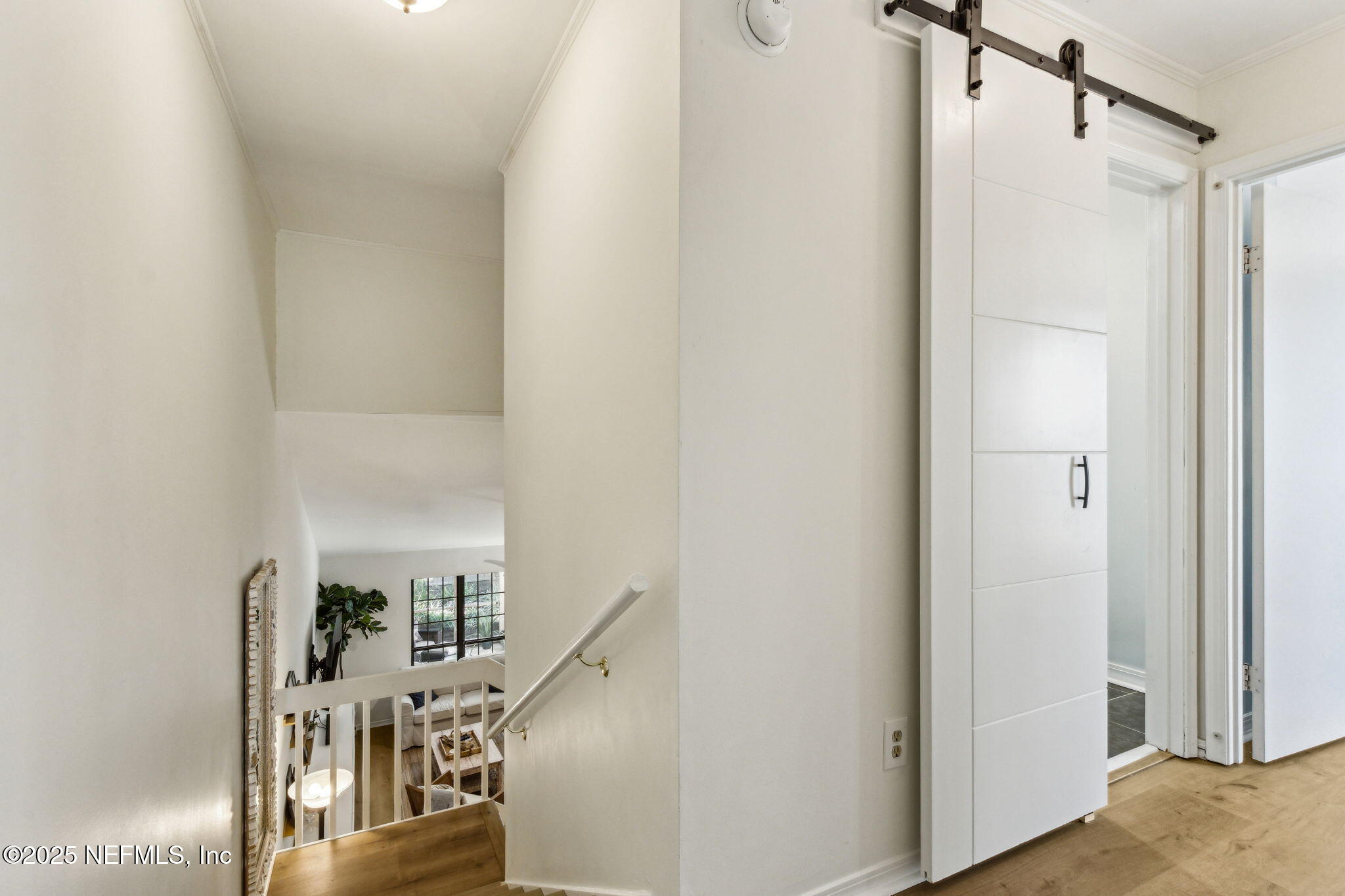 2751 West 5th Street, Unit B Fernandina Beach, FL 32034 - Photo 29 of 61 a view of a hallway with wooden floor and entryway