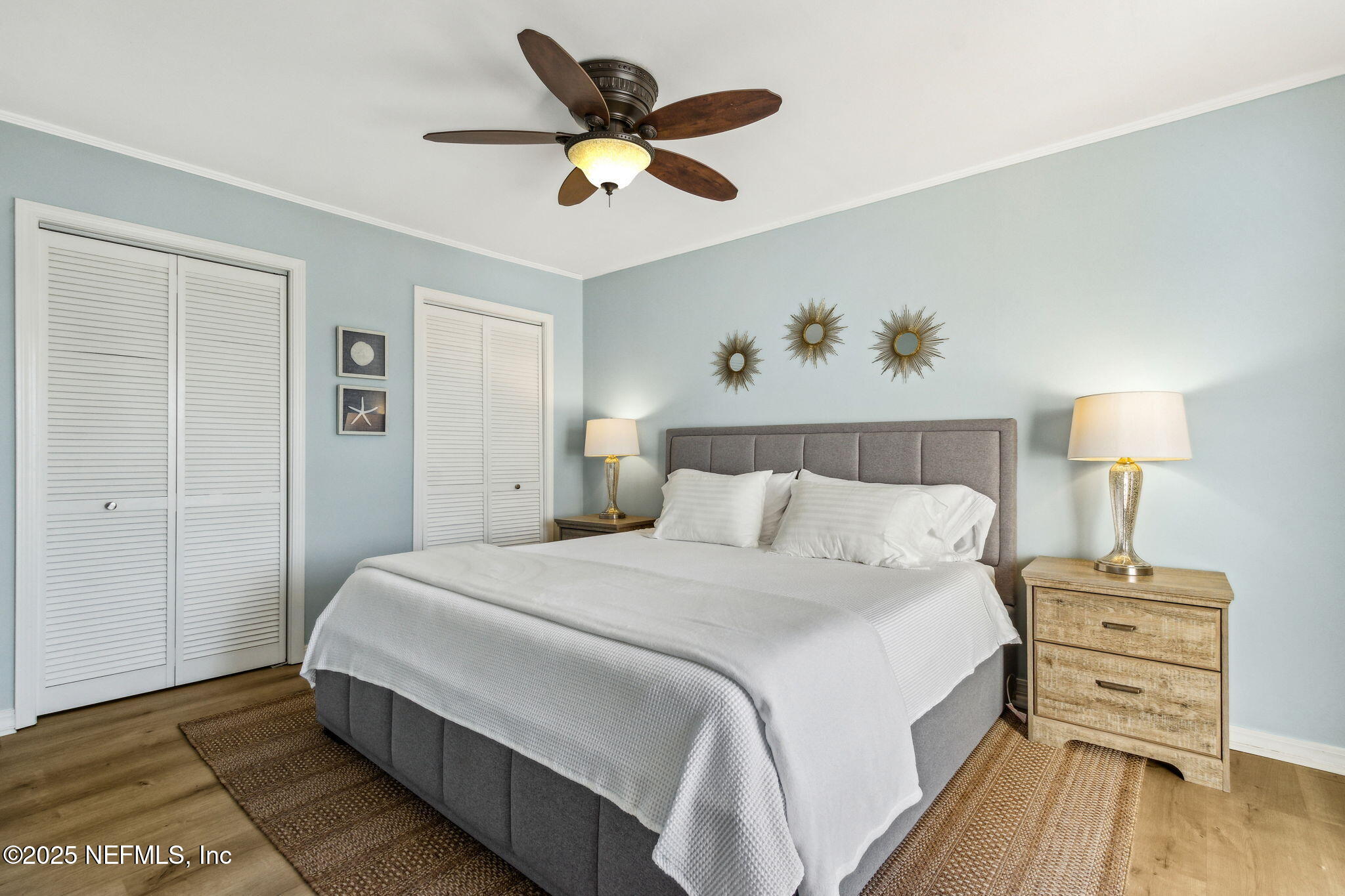 2751 West 5th Street, Unit B Fernandina Beach, FL 32034 - Photo 30 of 61 a bedroom with a bed and a table