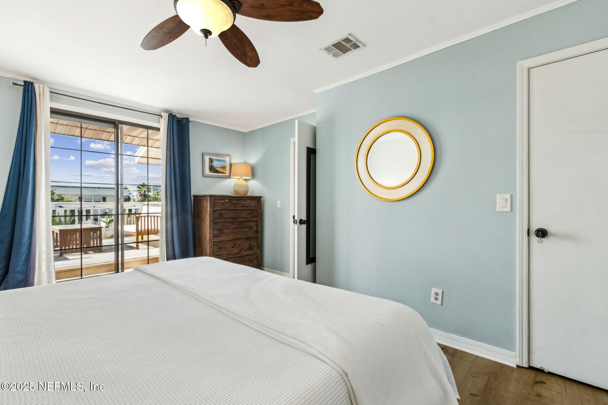 2751 West 5th Street, Unit B Fernandina Beach, FL 32034 - Photo 31 of 61 a bedroom with a bed and a window