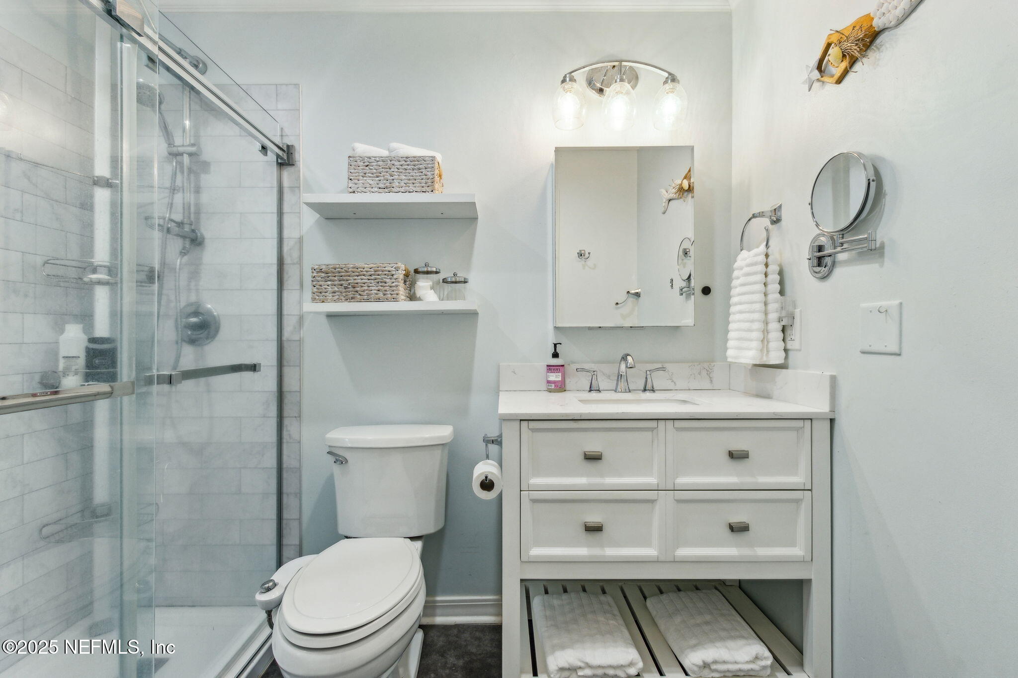 2751 West 5th Street, Unit B Fernandina Beach, FL 32034 - Photo 34 of 61 a bathroom with a sink a toilet and shower