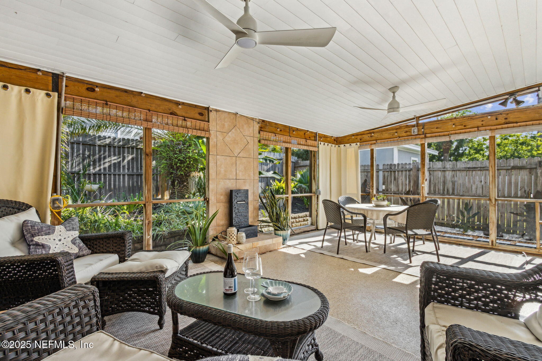 2751 West 5th Street, Unit B Fernandina Beach, FL 32034 - Photo 4 of 61 a living room with patio furniture and a floor to ceiling window