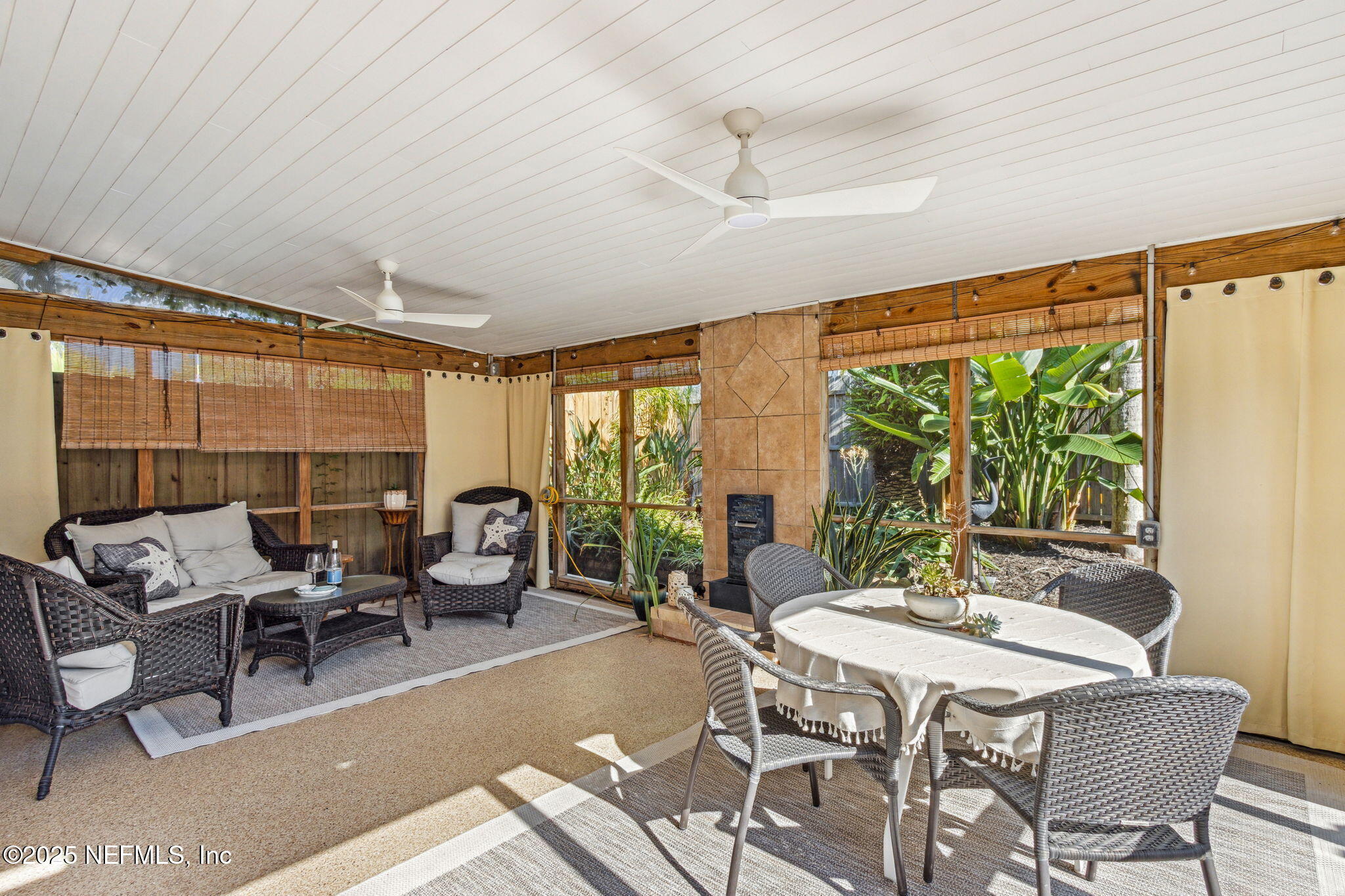 2751 West 5th Street, Unit B Fernandina Beach, FL 32034 - Photo 41 of 61 a dining room with furniture and a large window