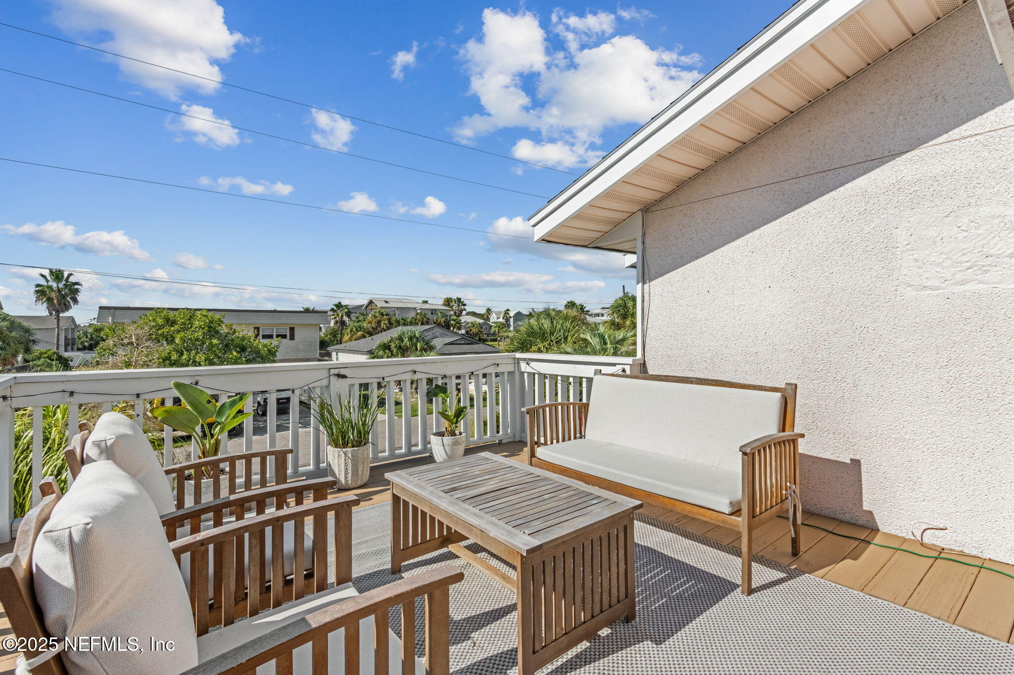 2751 West 5th Street, Unit B Fernandina Beach, FL 32034 - Photo 45 of 61 a view of a balcony with furniture