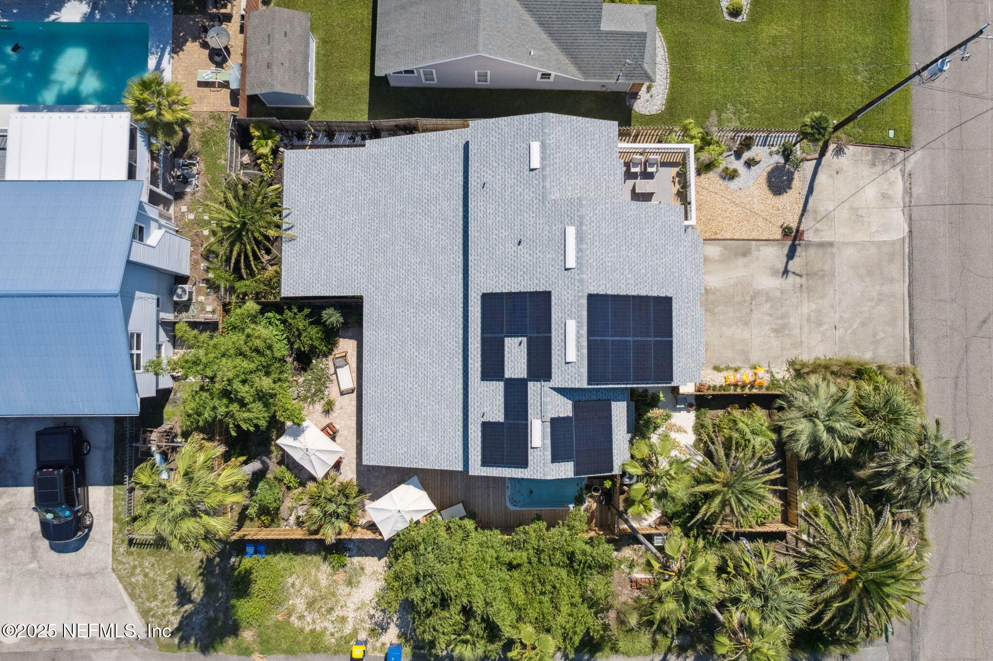 2751 West 5th Street, Unit B Fernandina Beach, FL 32034 - Photo 50 of 61 an aerial view of a house with a yard and garden