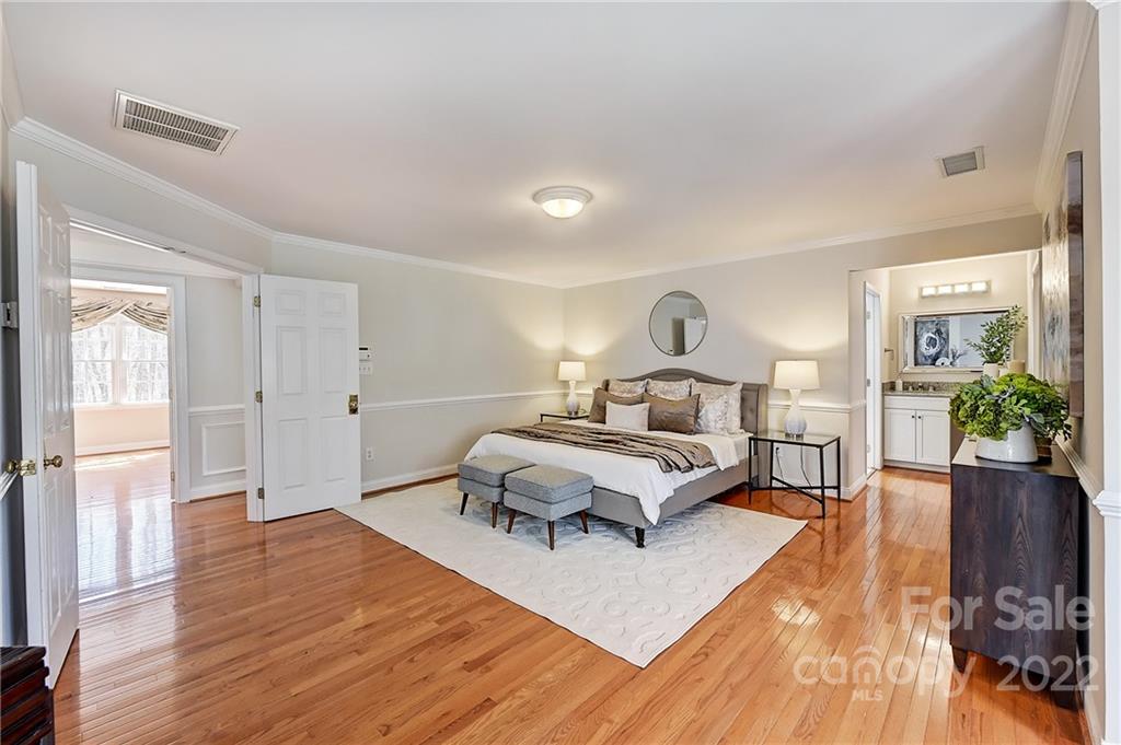 4222 Kronos Place Charlotte, NC 28210 - Photo 30 of 46 a living room with furniture and a wooden floor