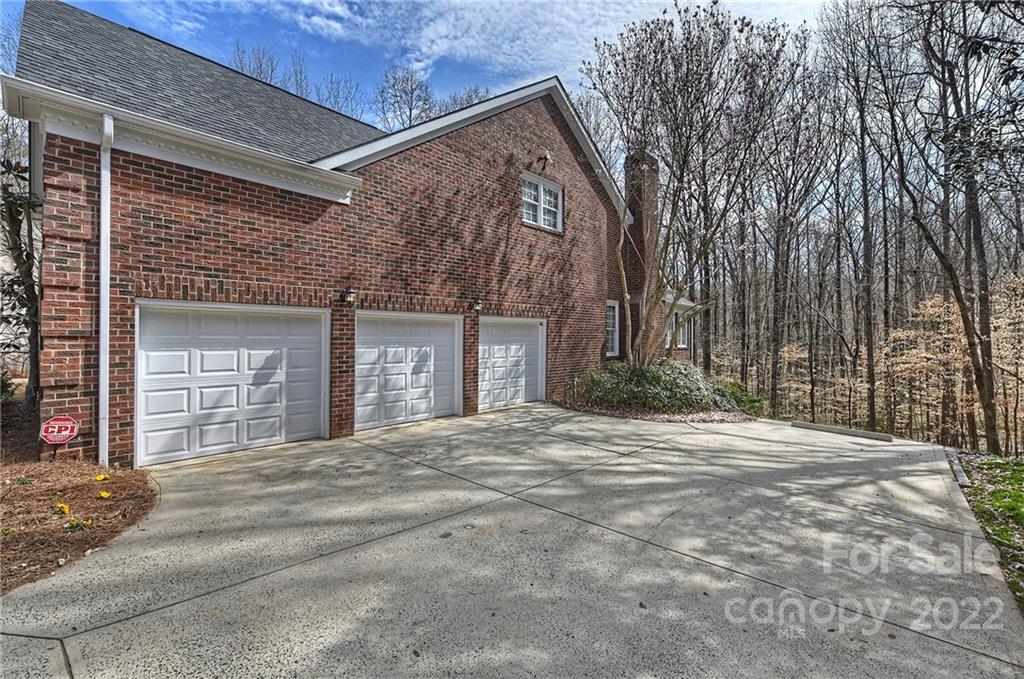 4222 Kronos Place Charlotte, NC 28210 - Photo 43 of 46 a front view of a house with a yard and garage