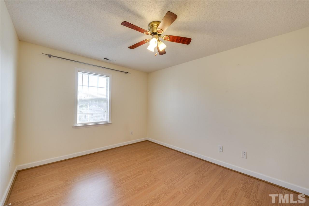 4421 Riverport Road Raleigh, NC 27616 - Photo 14 of 25 an empty room with window and ceiling fan