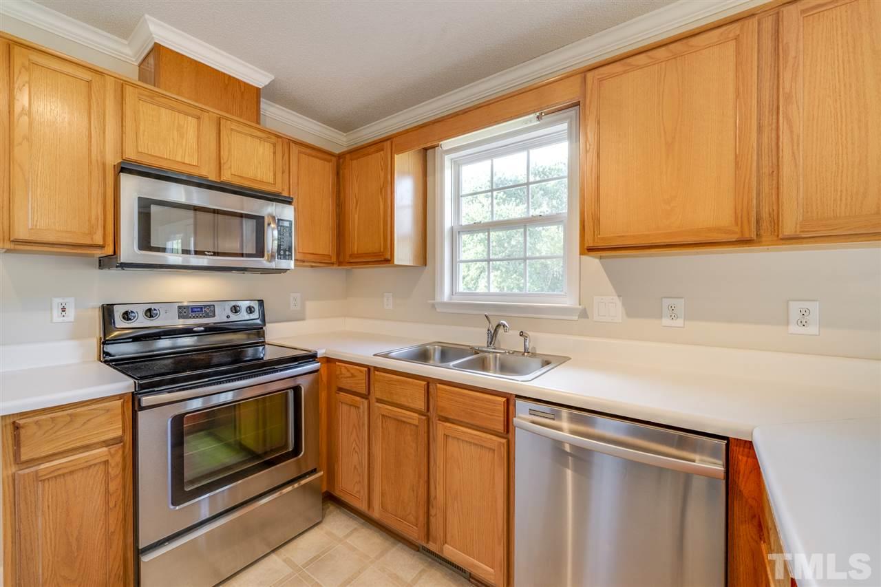 4421 Riverport Road Raleigh, NC 27616 - Photo 8 of 25 a kitchen with a sink stove and microwave