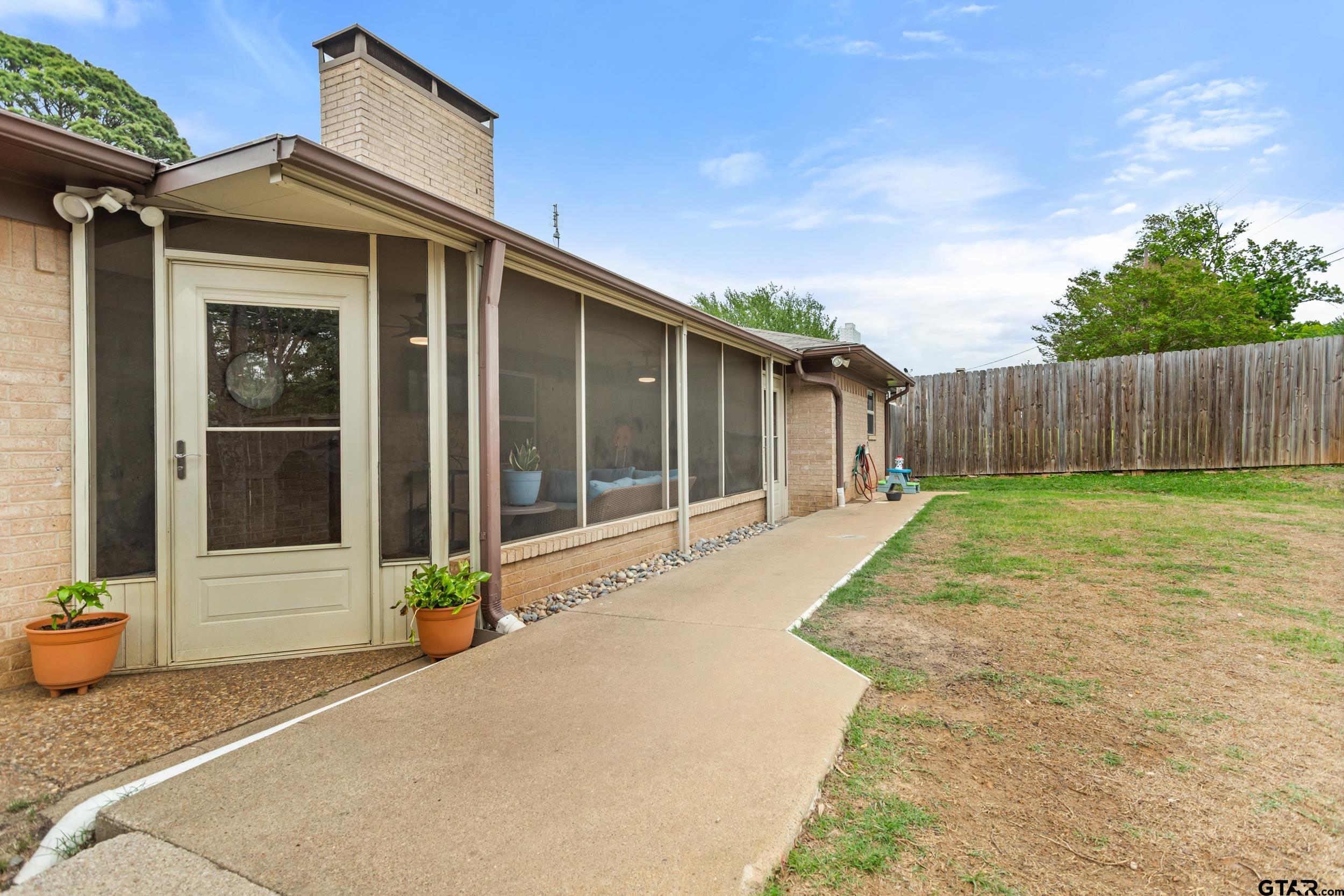 516 Ruthlynn Drive Longview, TX 75605 - Photo 31 of 34 a front view of a house having yard