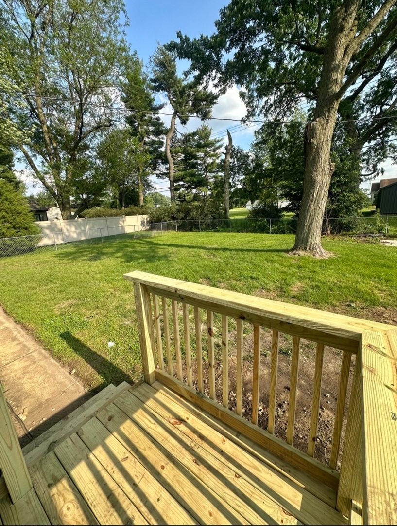 906 West Walnut Street Kankakee, IL 60901 - Photo 14 of 14 a view of a wooden deck with a yard