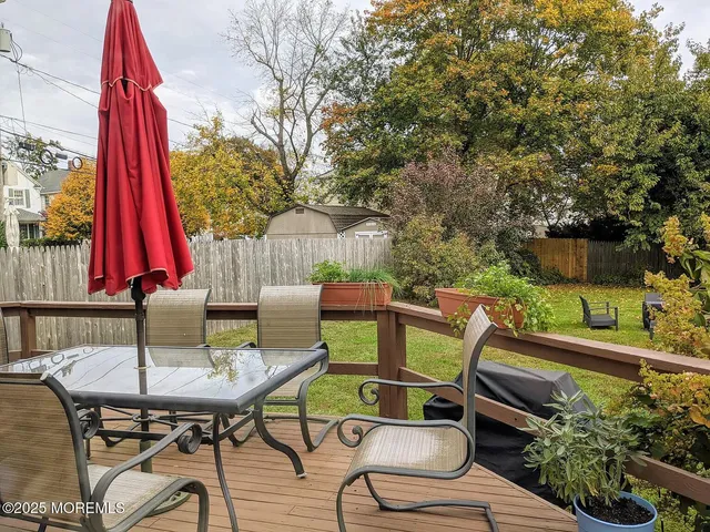 a view of a chairs and table in patio