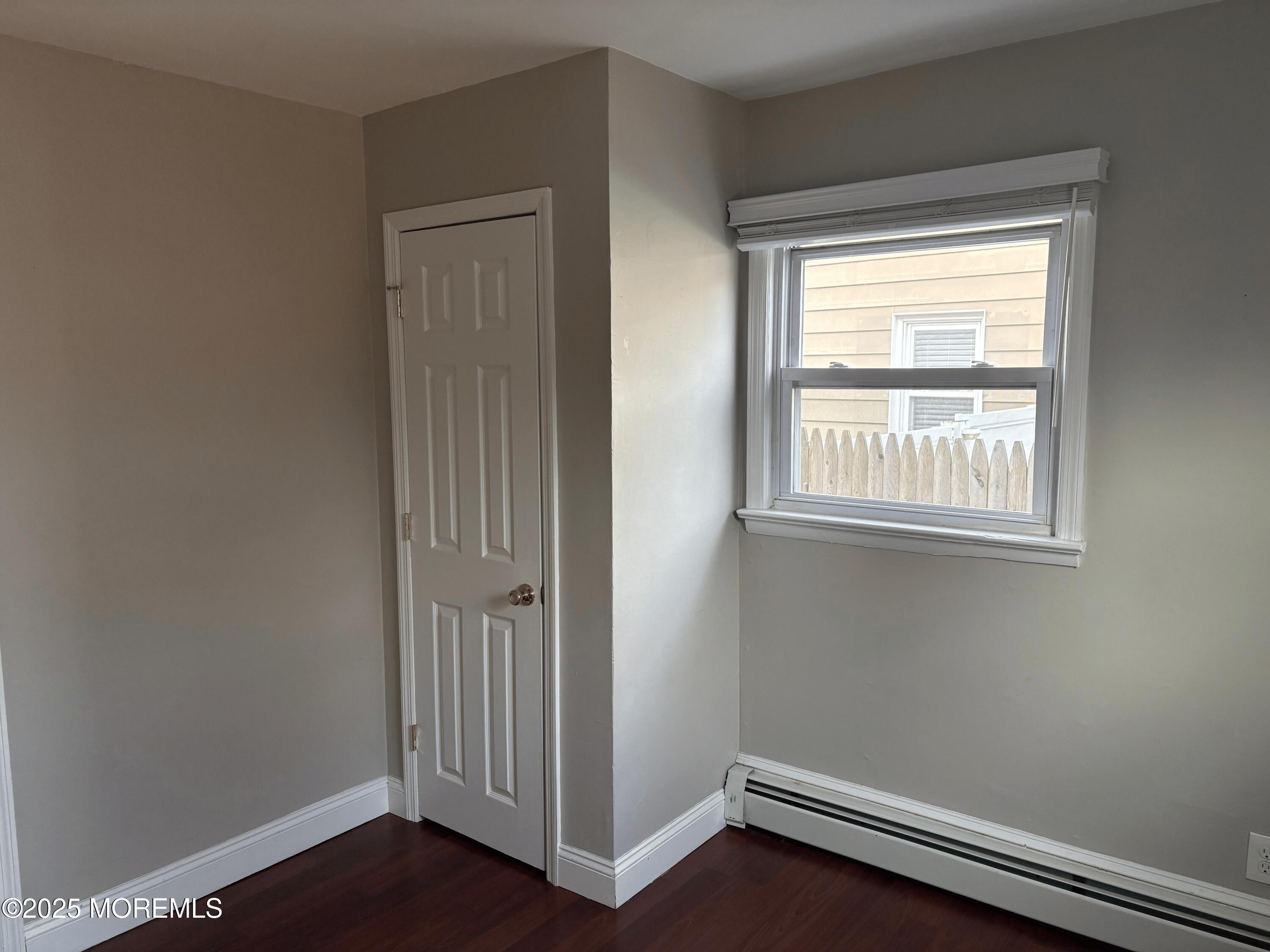 33 Prospect Avenue, Unit C Red Bank, NJ 07701 - Photo 9 of 15 an empty room with wooden floor and a window
