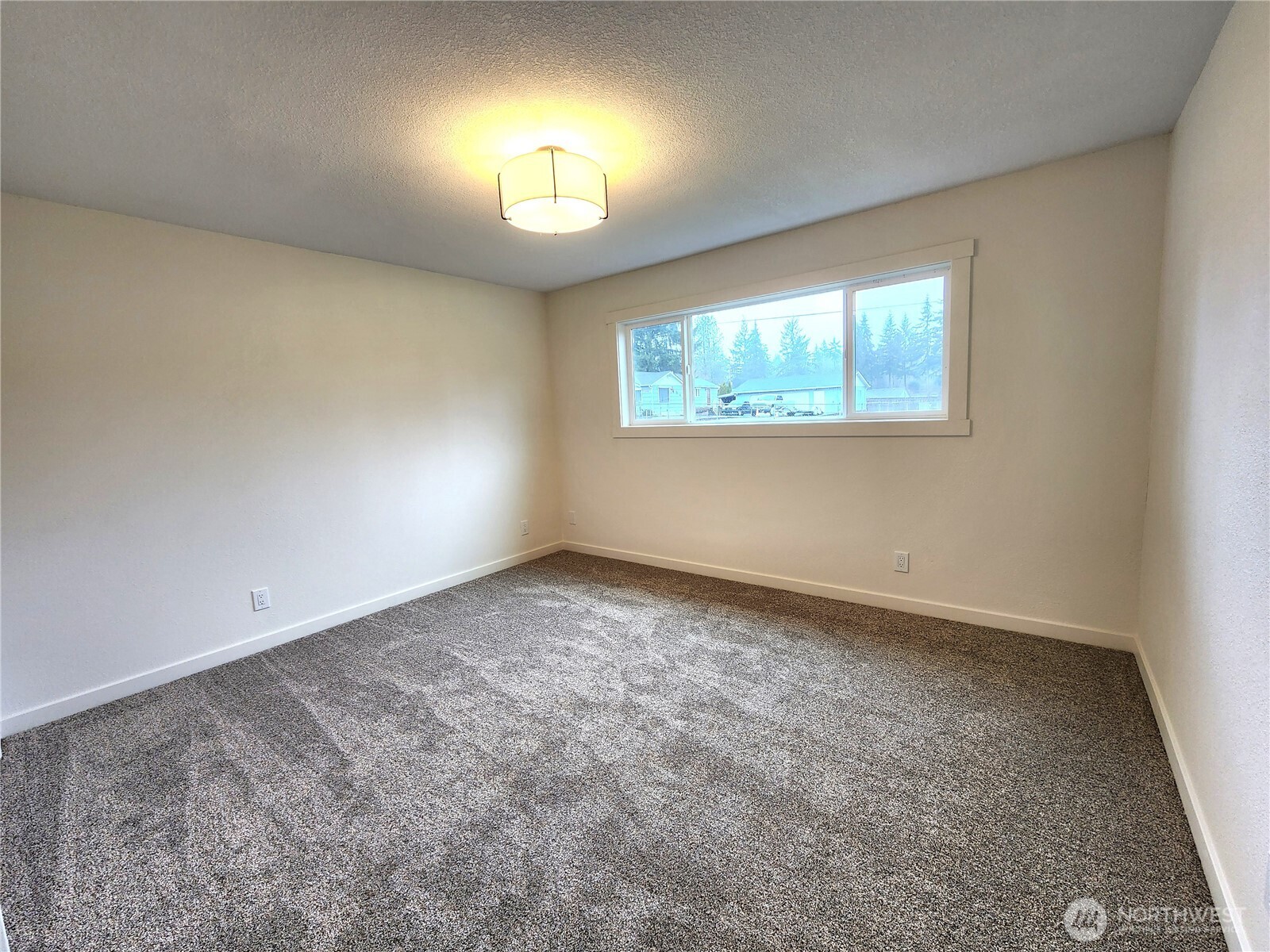 103 Kraft Road Longview, WA 98632 - Photo 11 of 19 an empty room with a window