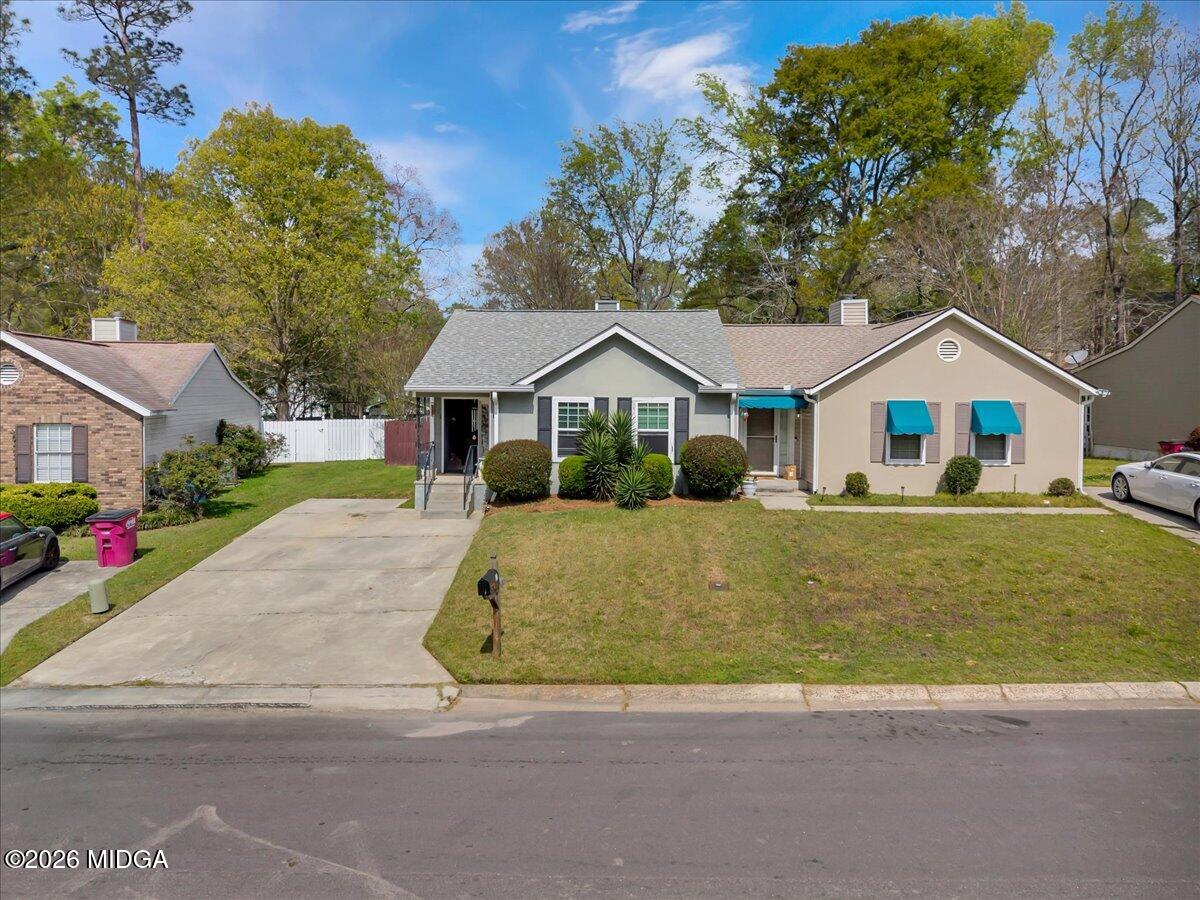 a house with trees in the background