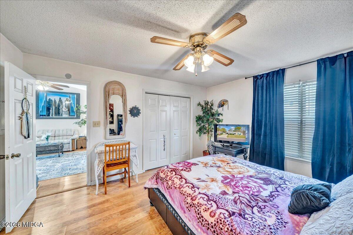 122 Wesleyan Way Macon, GA 31210 - Photo 12 of 20 a bedroom with a bed and a chandelier
