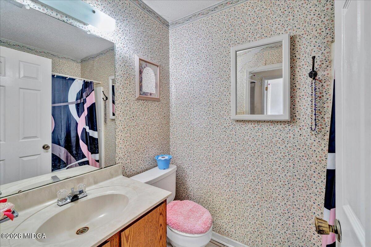 122 Wesleyan Way Macon, GA 31210 - Photo 16 of 20 a bathroom with a sink toilet and shower
