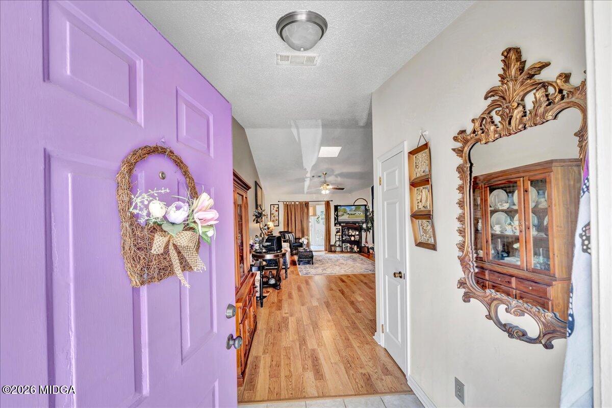 122 Wesleyan Way Macon, GA 31210 - Photo 3 of 20 a view of entryway livingroom and hall with wooden floor