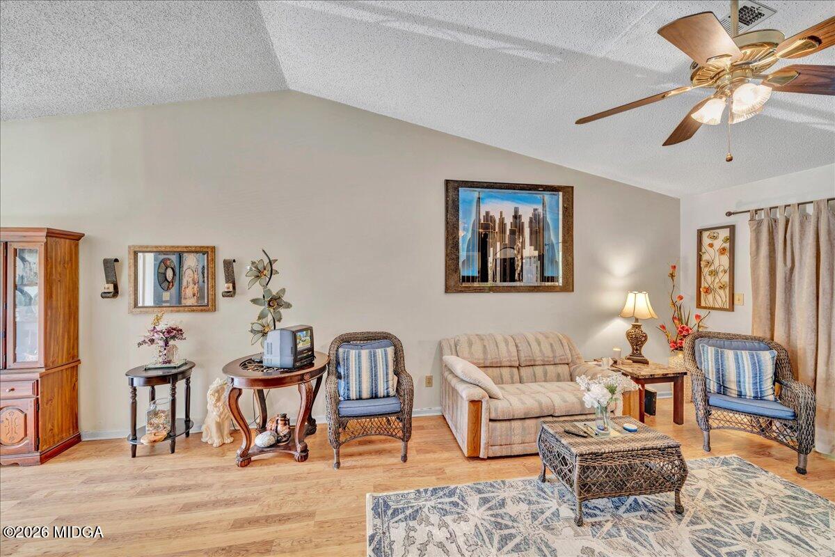 122 Wesleyan Way Macon, GA 31210 - Photo 6 of 20 a living room with furniture and wooden floor