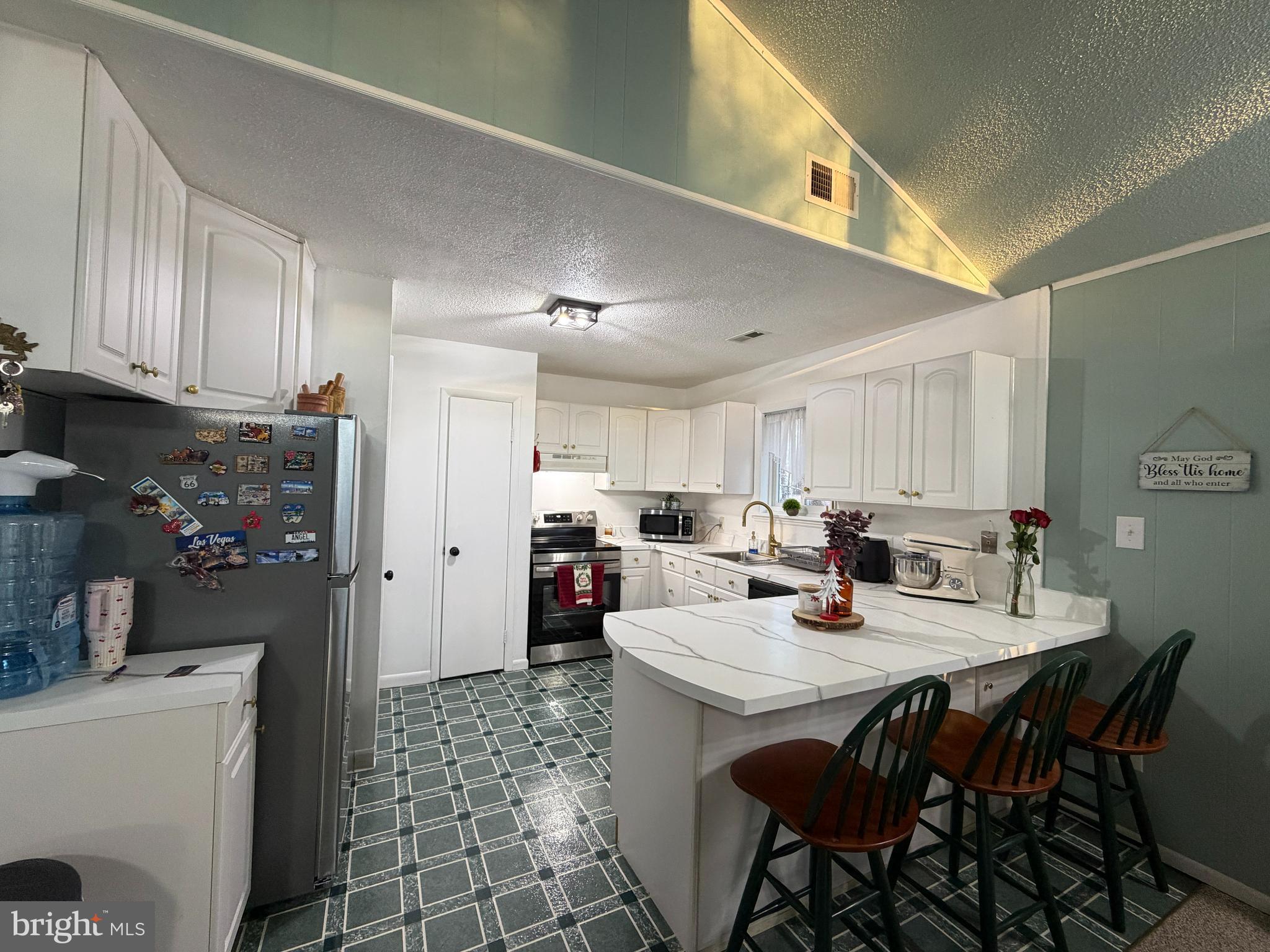 359 Straton Way Basye, VA 22842 - Photo 15 of 38 a kitchen with a dining table and chairs