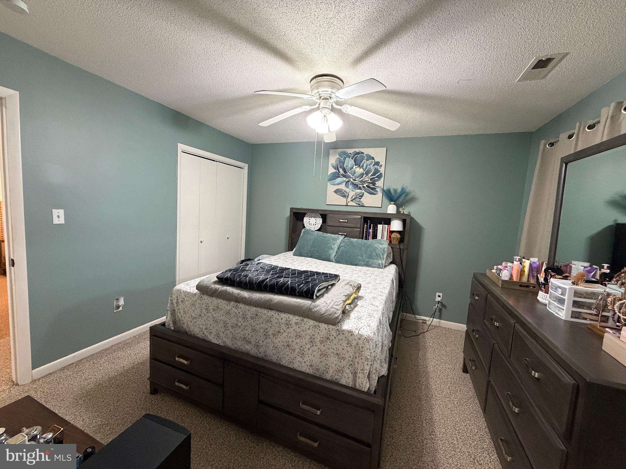 359 Straton Way Basye, VA 22842 - Photo 20 of 38 a bedroom with a bed and a chandelier