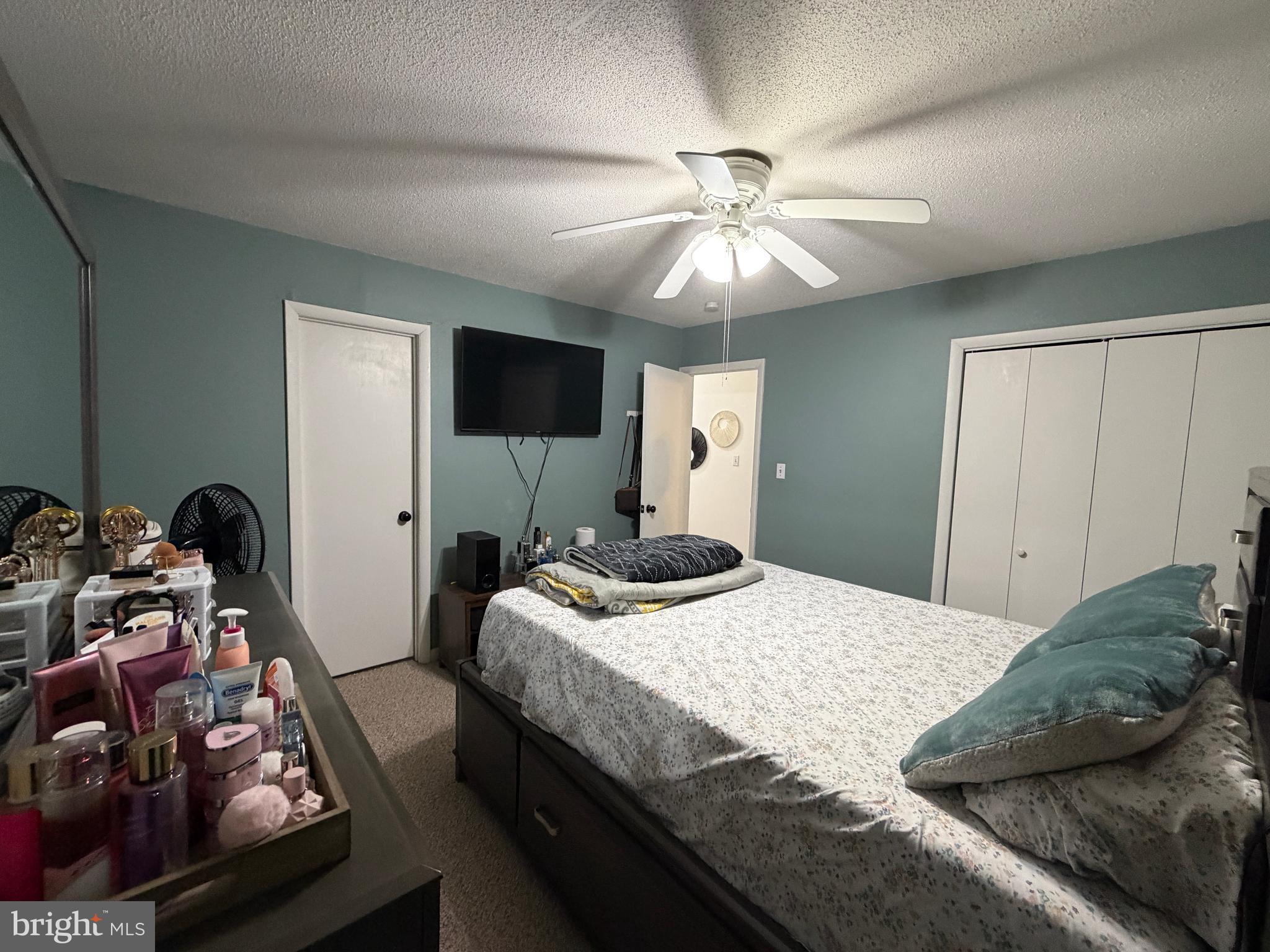 359 Straton Way Basye, VA 22842 - Photo 21 of 38 a bedroom with a bed and a chandelier