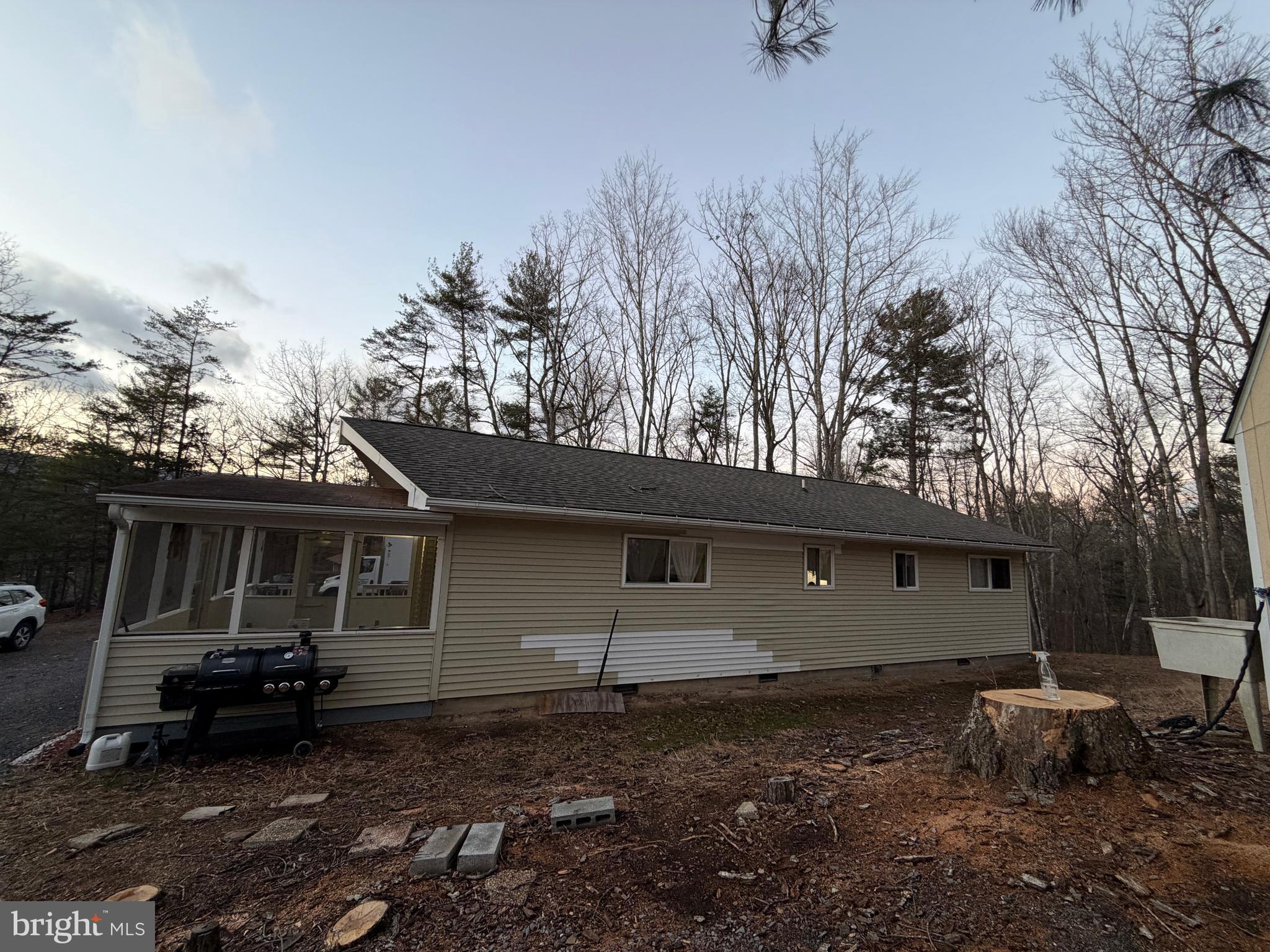 359 Straton Way Basye, VA 22842 - Photo 32 of 38 a backyard of a house with table and chairs