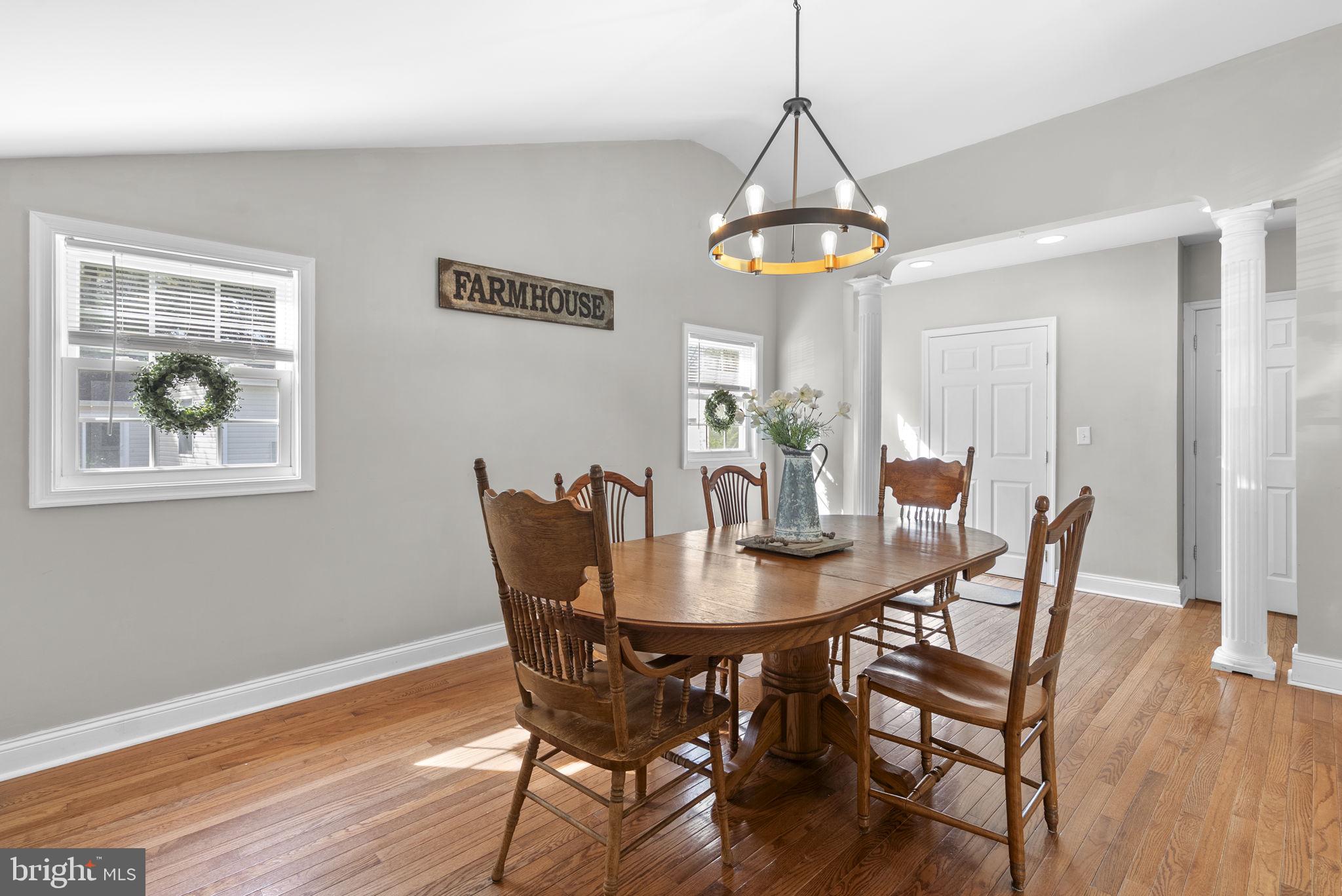604 Perrys Corner Road Grasonville, MD 21638 - Photo 11 of 32 a dining room with furniture a chandelier and wooden floor