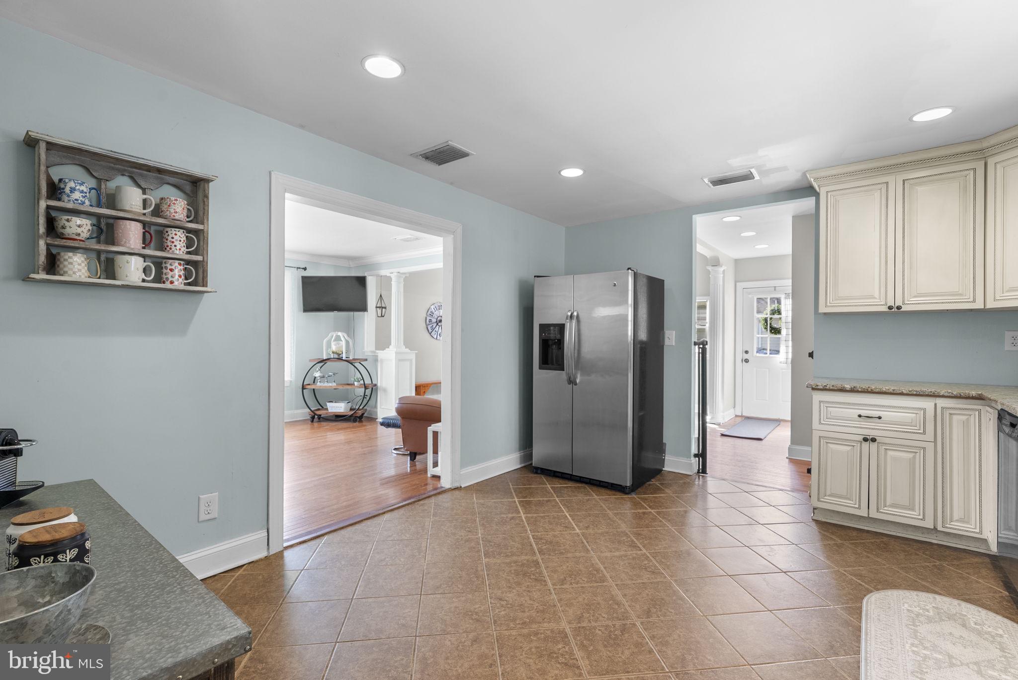 604 Perrys Corner Road Grasonville, MD 21638 - Photo 14 of 32 a view of a kitchen with refrigerator and windows