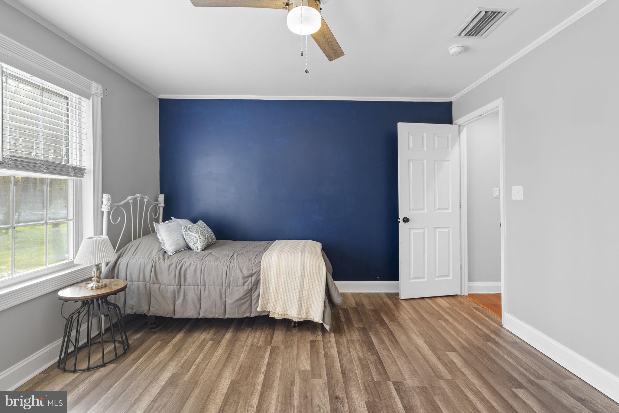 604 Perrys Corner Road Grasonville, MD 21638 - Photo 19 of 32 a bedroom with a bed and window