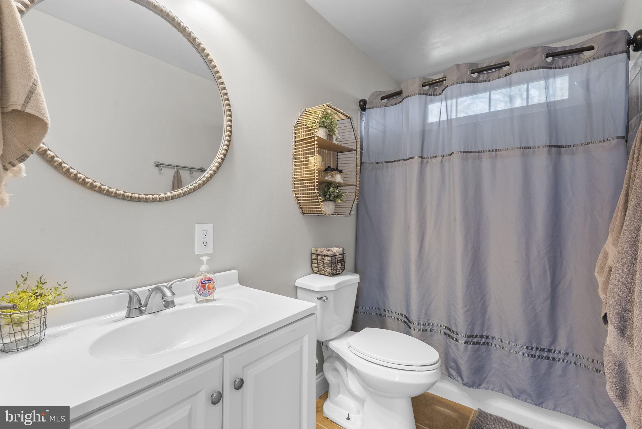 604 Perrys Corner Road Grasonville, MD 21638 - Photo 20 of 32 a bathroom with a sink a toilet and shower