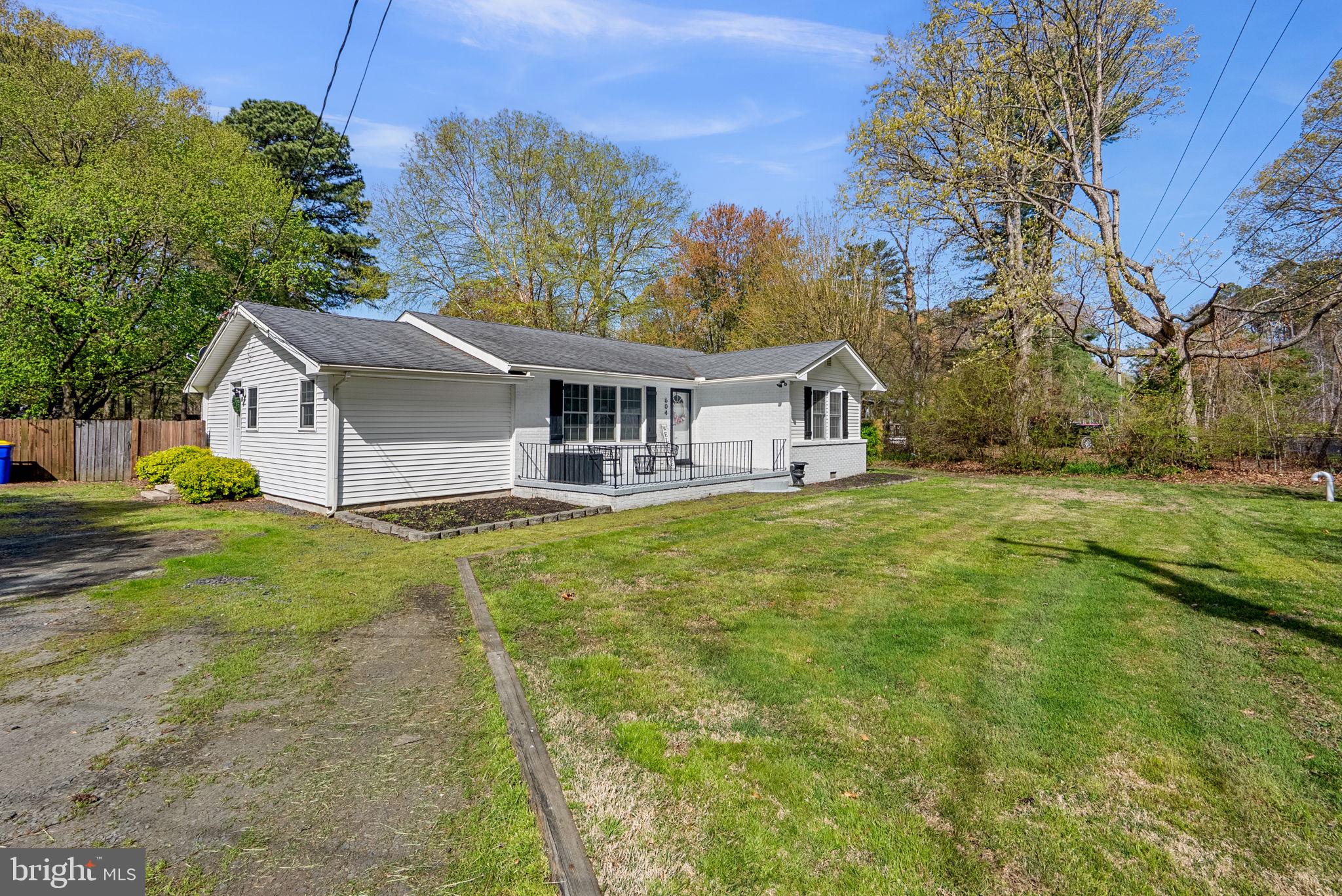 604 Perrys Corner Road Grasonville, MD 21638 - Photo 2 of 32 a front view of a house with garden