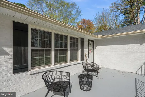 a view of a chair and table in the balcony