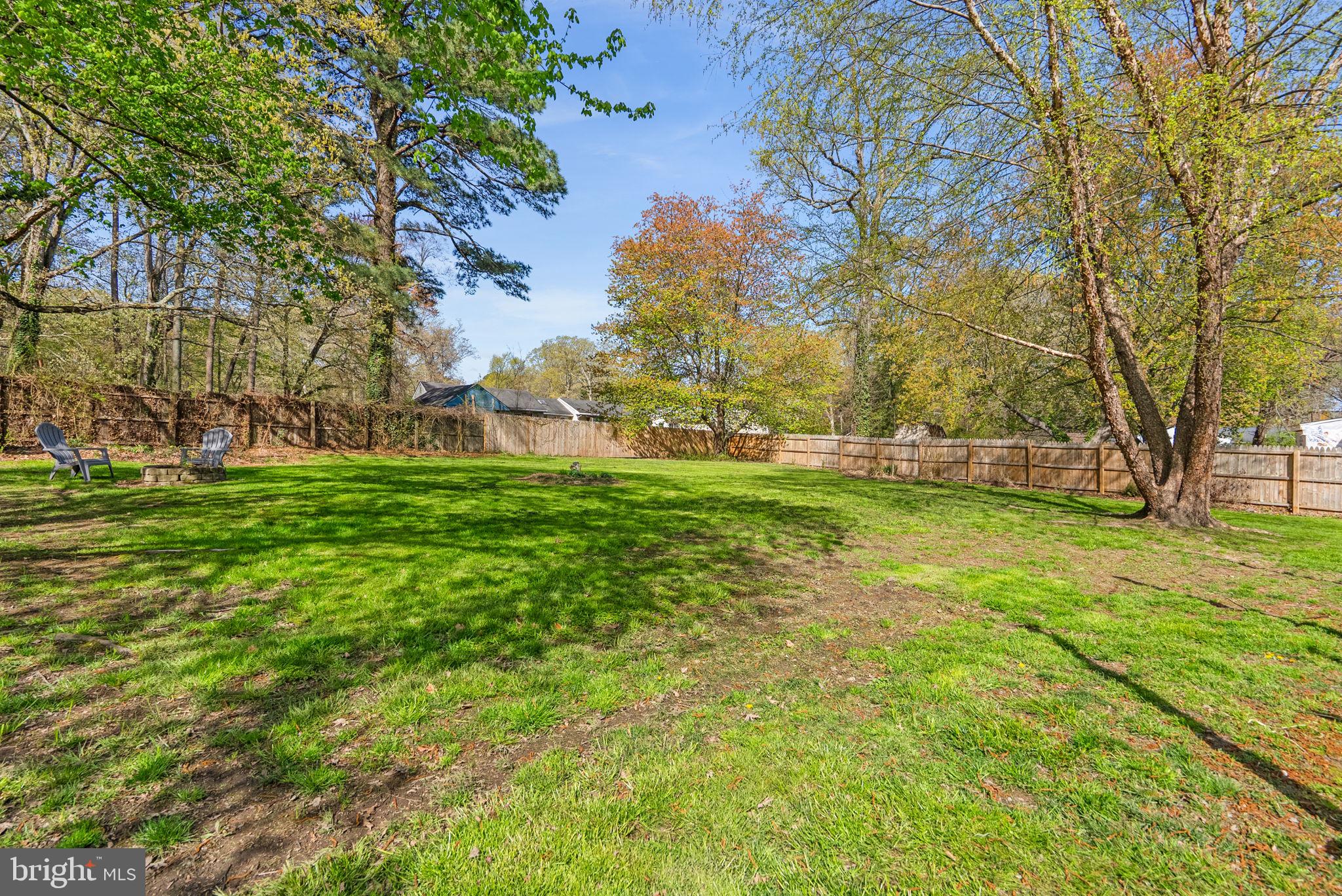 604 Perrys Corner Road Grasonville, MD 21638 - Photo 28 of 32 a backyard of a house with lots of green space and garden
