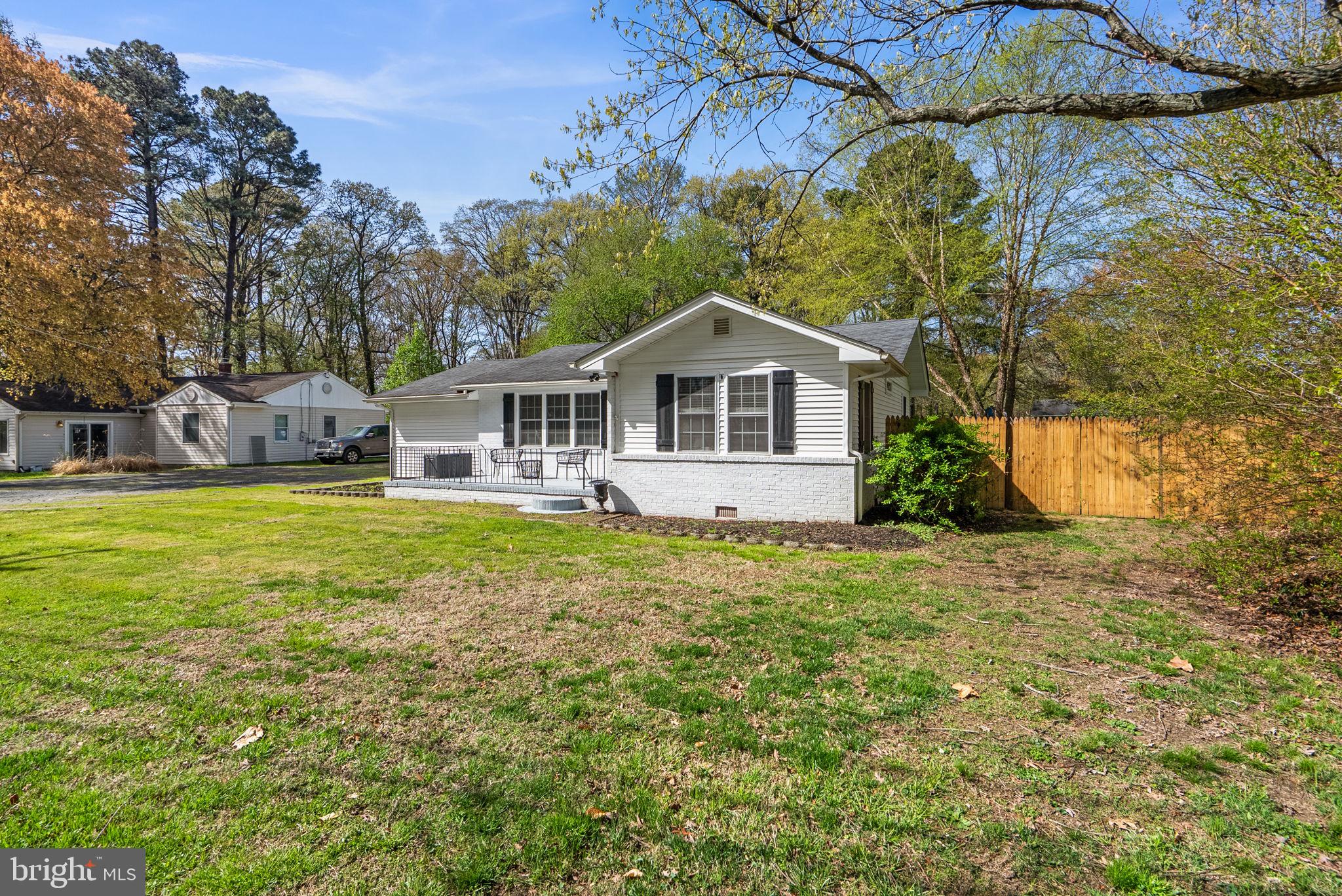 604 Perrys Corner Road Grasonville, MD 21638 - Photo 4 of 32 a front view of a house with garden