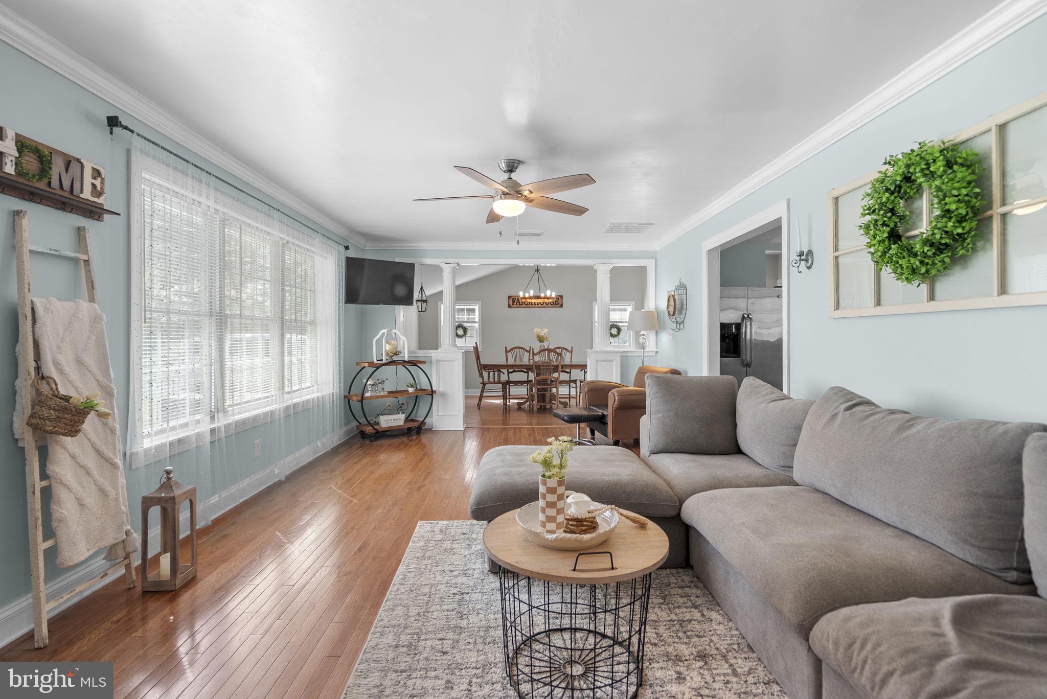 604 Perrys Corner Road Grasonville, MD 21638 - Photo 5 of 32 a living room with furniture and a large window