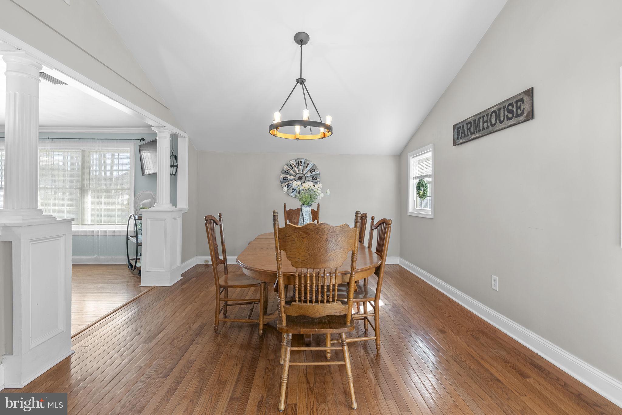 604 Perrys Corner Road Grasonville, MD 21638 - Photo 10 of 32 a dining room with furniture a chandelier and wooden floor