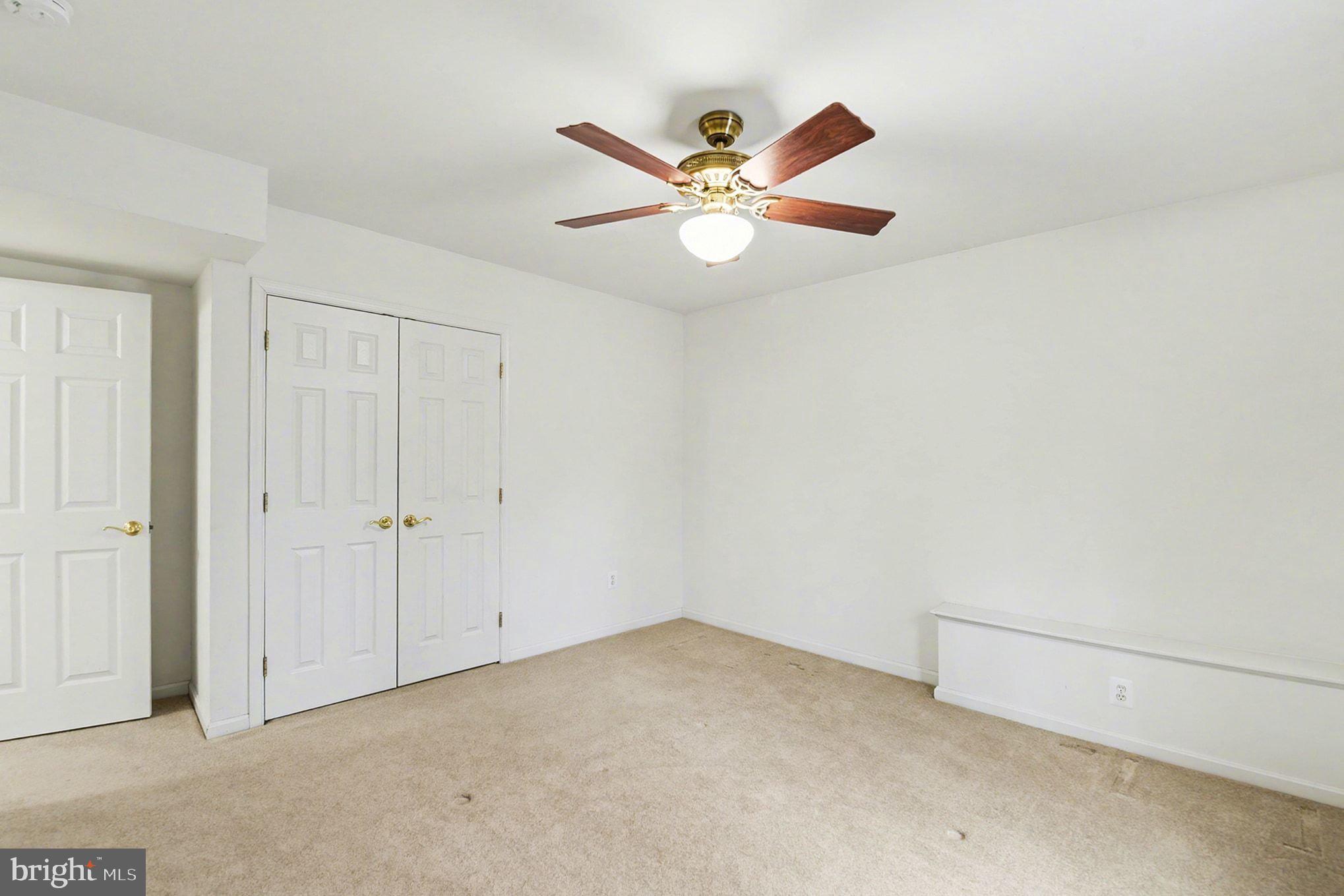 1645 Timber Summit Drive Westminster, MD 21157 - Photo 28 of 65 a view of a livingroom with a ceiling fan